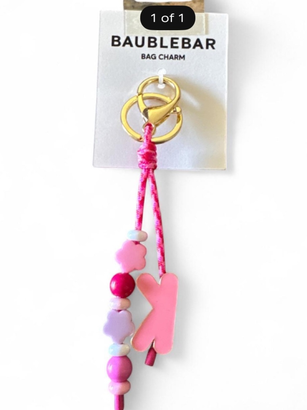Baublebar pink and white beaded bag charm with heart and butterfly shapes
